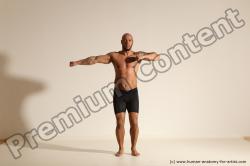 Underwear Gymnastic poses Man Black Muscular Bald Dancing Dynamic poses Academic